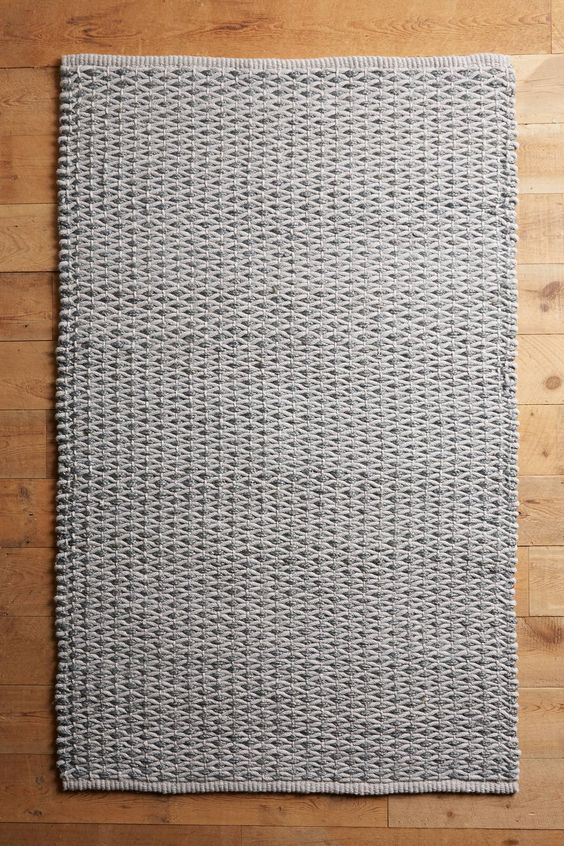 Woven dark floor rug