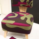 Modern slipper chairs can feature different shapes and bold upholstery.